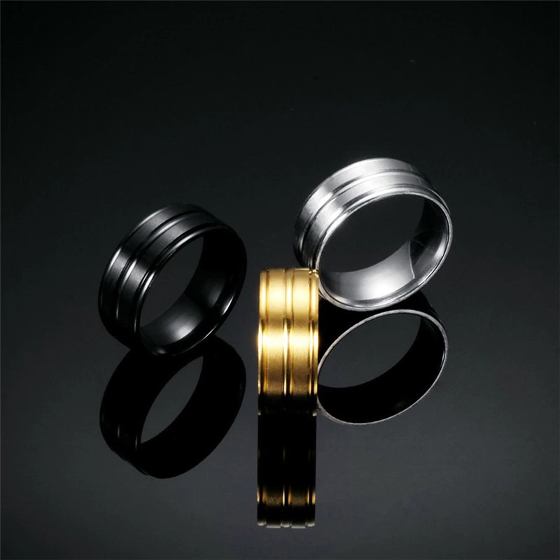 Cool stainless steel unisex rings in black, silver, and gold - stylish alternative jewelry for men and women.