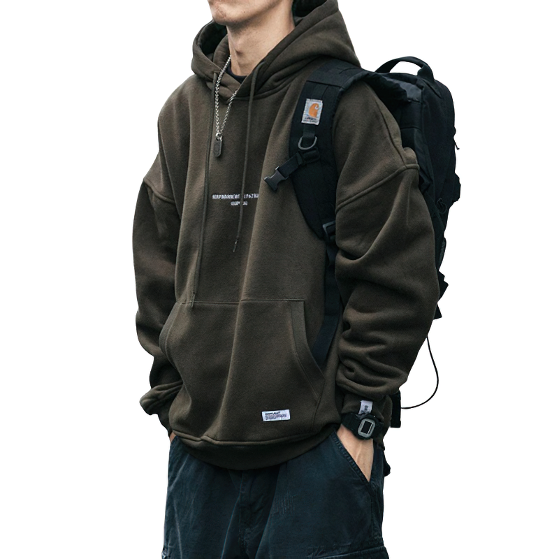 Stylish men's thin fleece hoodie in casual streetwear style, worn with a backpack and featuring an oversized cut.