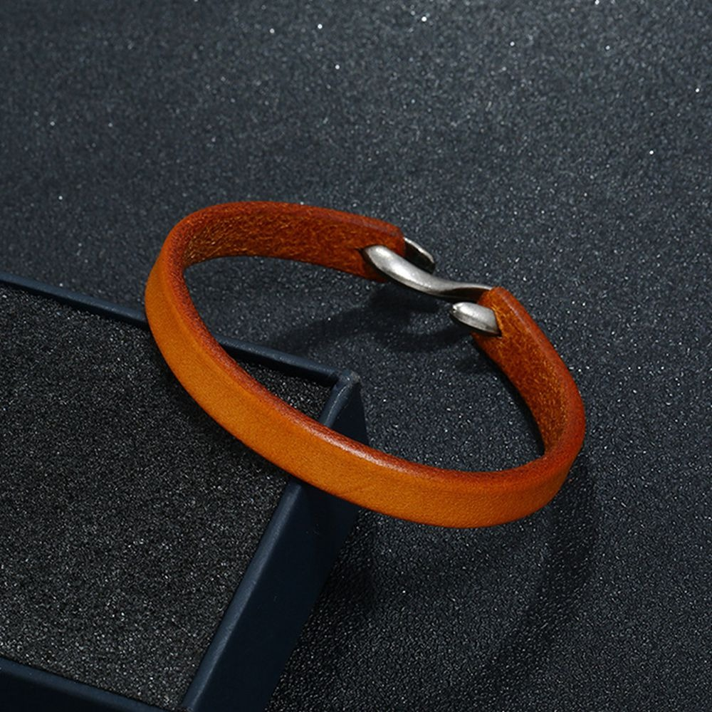 Cool unisex genuine leather narrow bracelet in vibrant orange, perfect for a casual rock-style accessory.