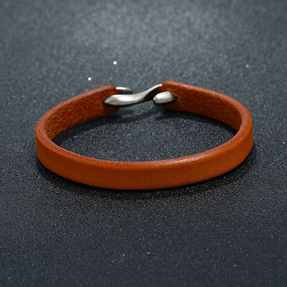Cool unisex genuine leather narrow cuff bracelet in warm brown for casual rock style outfits.
