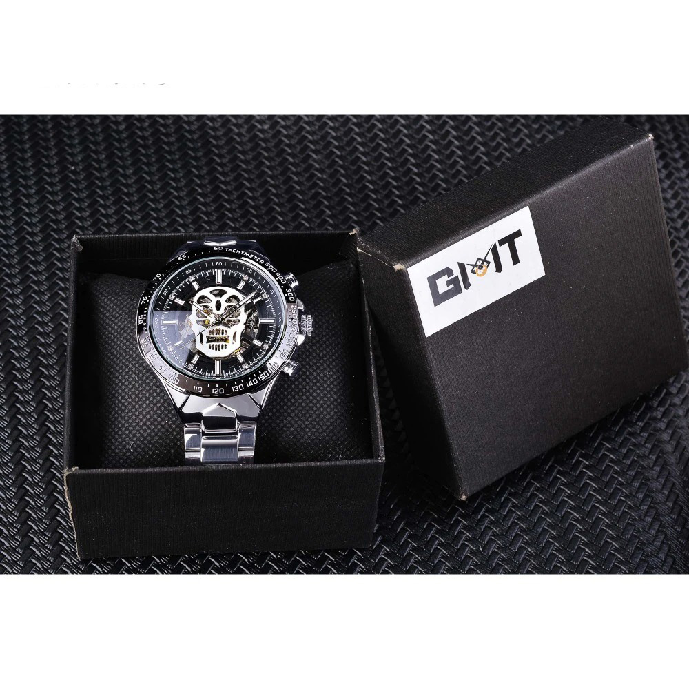 Cool gothic mechanical watch with luminous hands featuring a skull, elegantly presented in a stylish box.