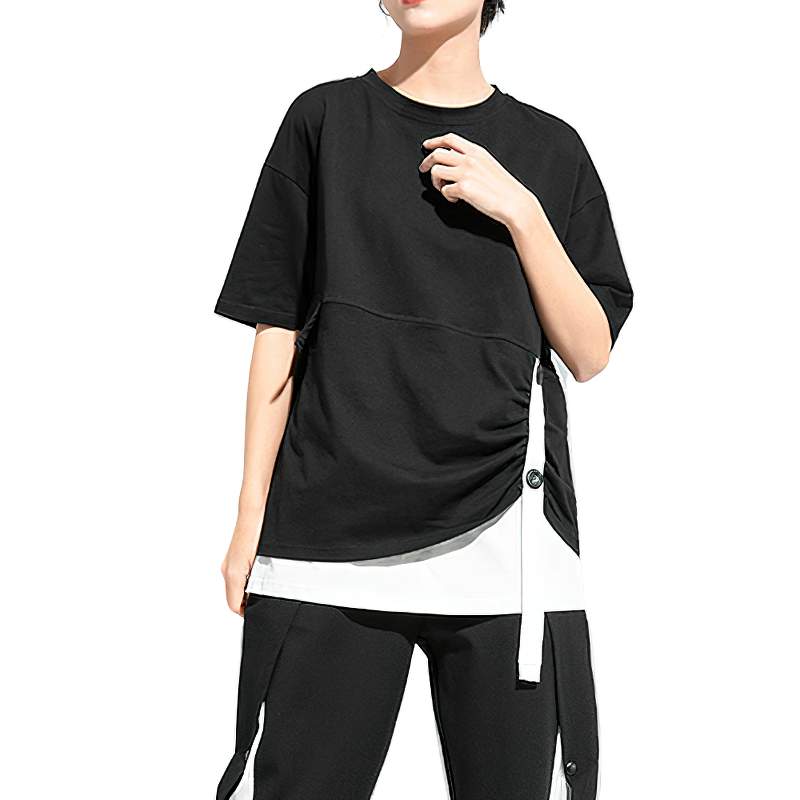 Cool women's black pleated t-shirt with short sleeves, stylish buttons, and white elements for a trendy look.