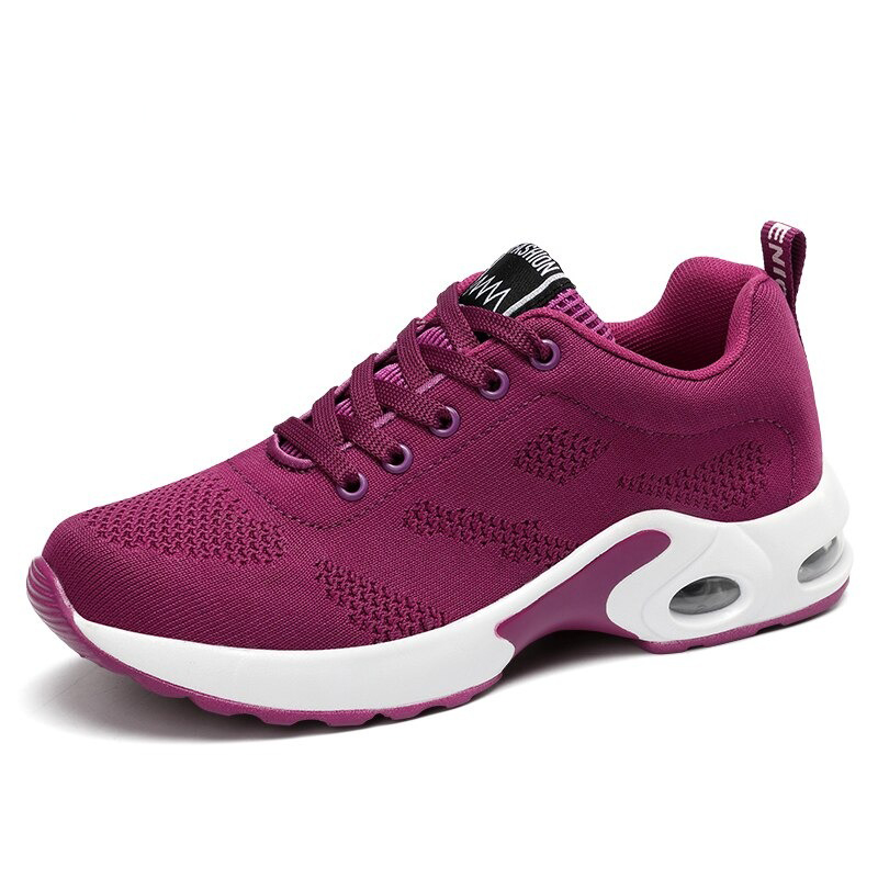 Cool women's lace-up sneakers in vibrant purple, featuring breathable mesh and stylish round toe design.