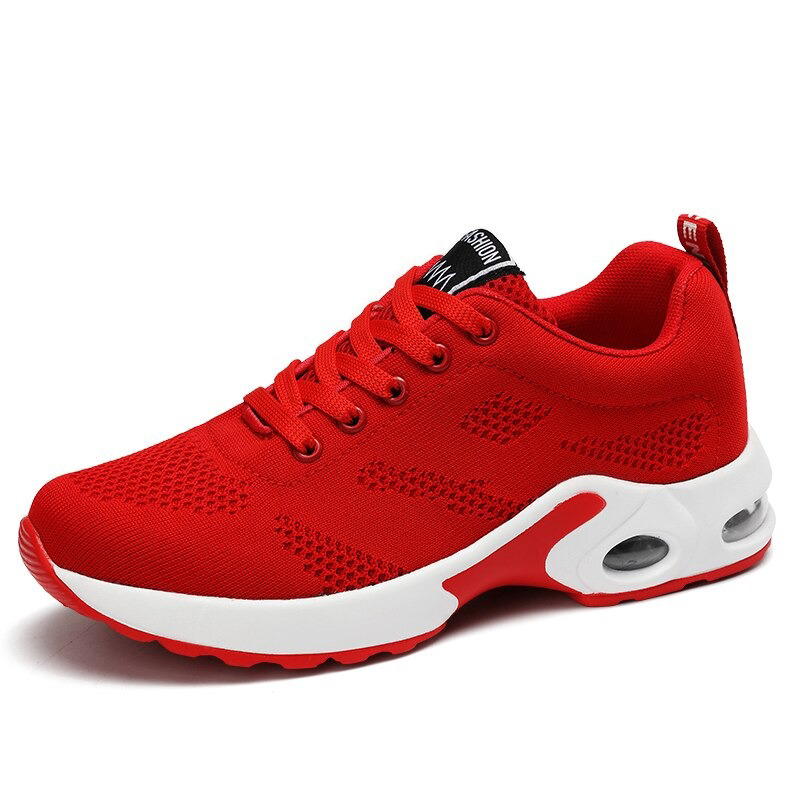 Stylish red women's lace-up sneakers with mesh design for breathability and comfort.