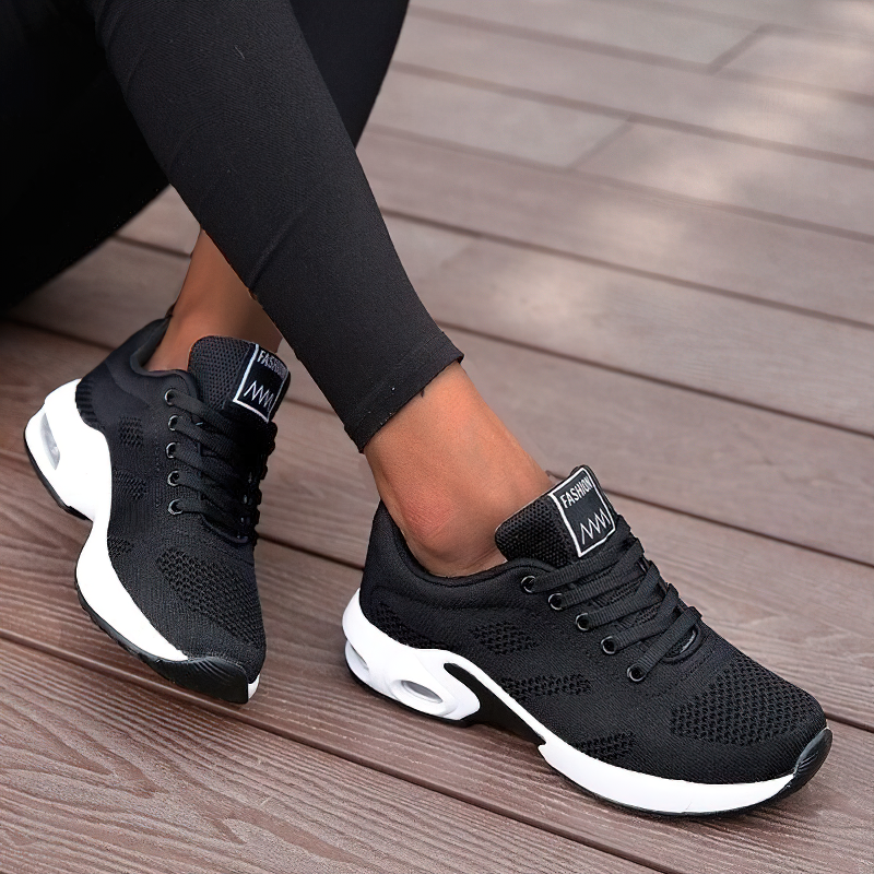 Cool black women's lace-up sneakers with air mesh design and trendy round toe, perfect for stylish outfits.