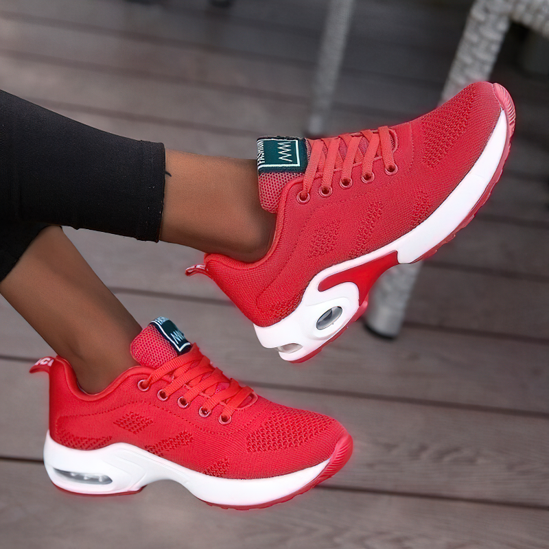 Stylish women's red lace-up sneakers made of breathable mesh, perfect for trendy outfits and comfort.