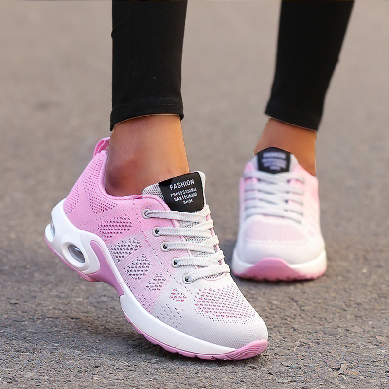 Cool women's lace-up pink and gray sneakers with breathable mesh for stylish looks.