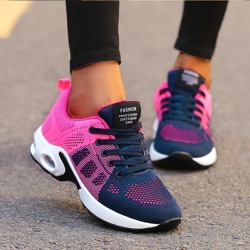 Trendy women's lace-up sneakers in pink and navy blue, featuring breathable mesh and stylish design for fashion-forward looks.