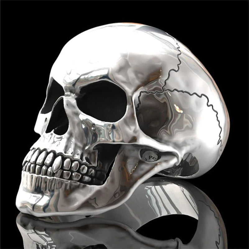 Stylish cracked skull head ring in shiny metal, perfect for rock and gothic fashion lovers.