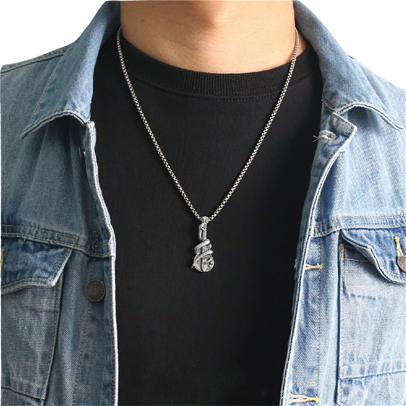 Unisex rock style silver guitar pendant worn by a person, showcasing trendy jewelry in a denim jacket.