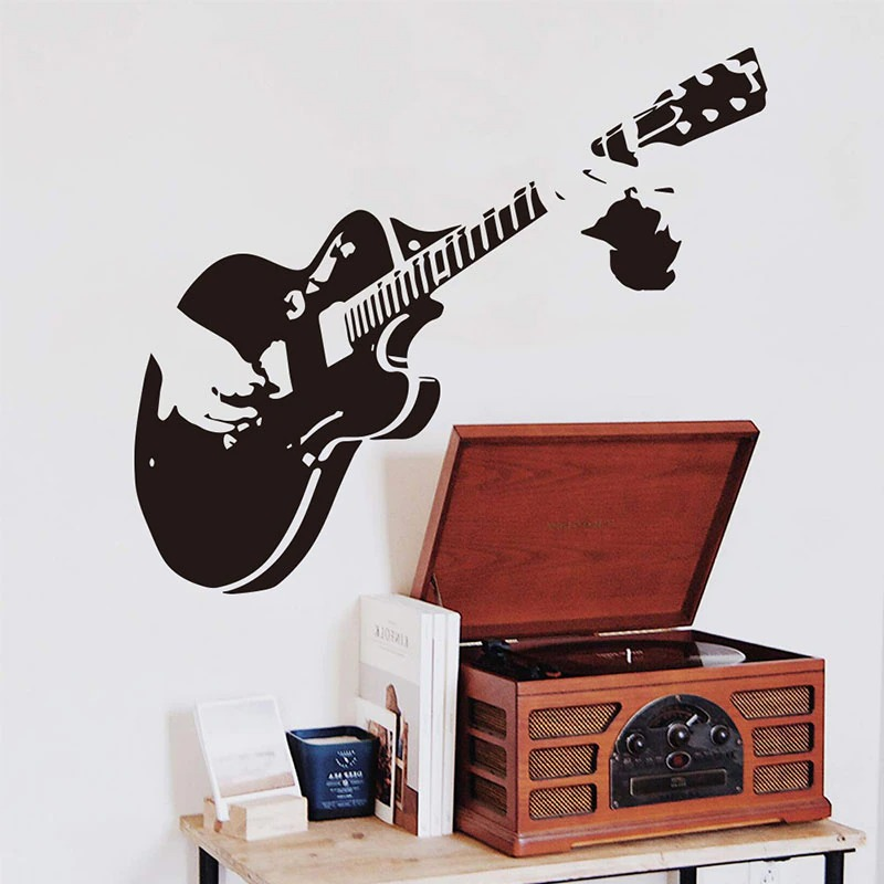 Creative vinyl guitar wall sticker showcasing hands playing music, perfect for home decor enthusiasts.