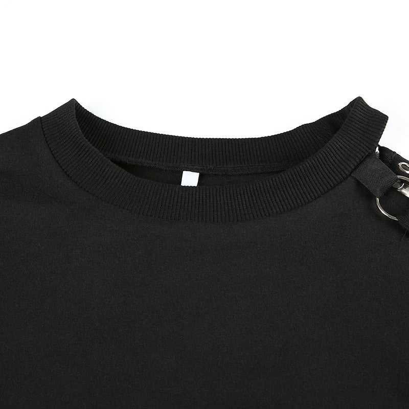 Close-up of black cropped women’s top collar with chain detail, showcasing Gothic style and unique design features.