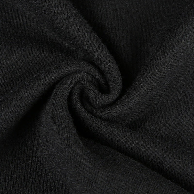 Close-up of black cotton fabric, showcasing softness and texture for gothic-style cropped top.