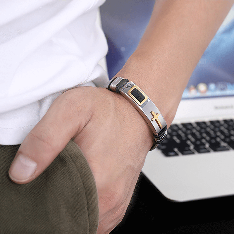 Stylish stainless steel cross bracelet worn by a model, perfect for bikers and punk fashion lovers.