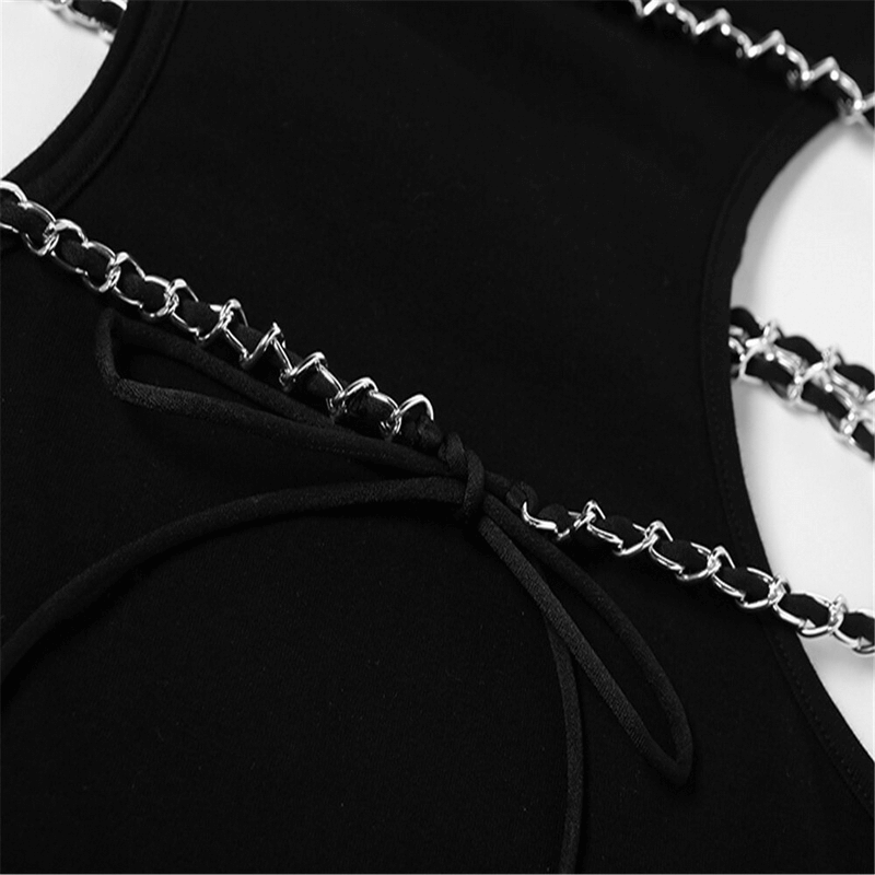 Close-up of black bodycon mini dress featuring a stylish chain belt and intricate tying detail.