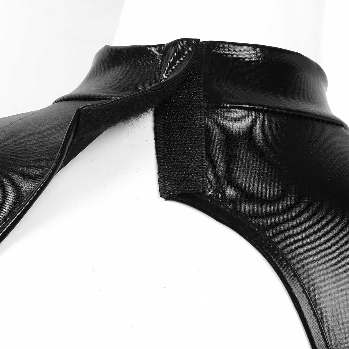 Close-up of a cut-out shoulder design on a black bodycon mini dress showcasing stylish keyhole detail.