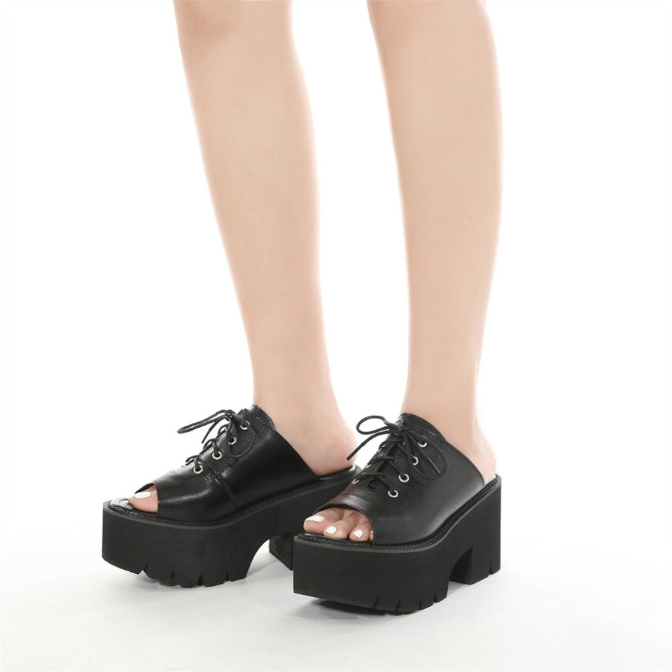 Stylish women's open toe black leather platform mules sandals with lace-up design, perfect for gothic fashion.