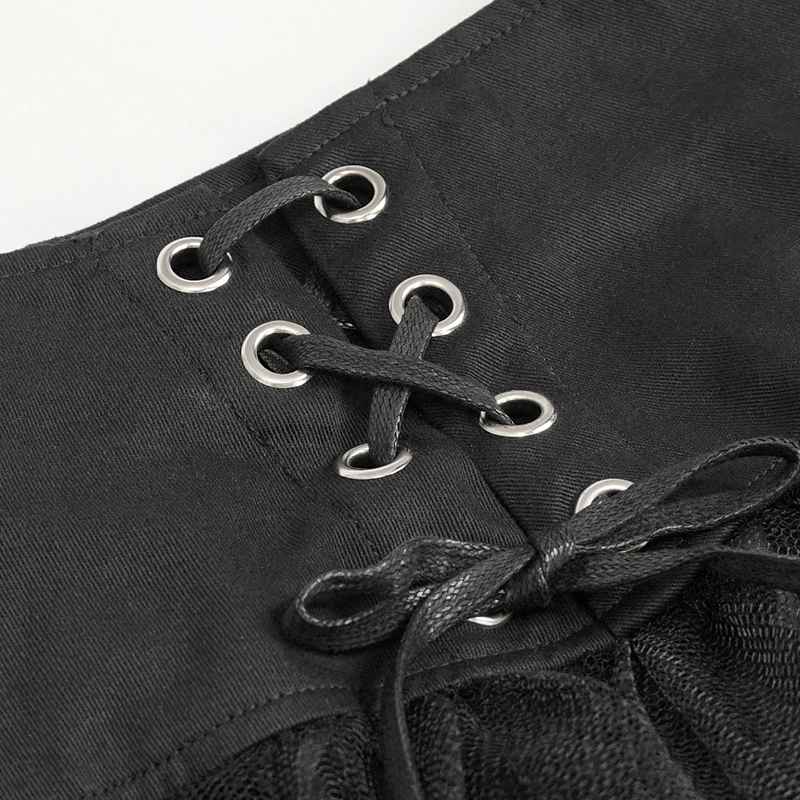 Close-up of the waist with laced eyelets design on a black punk skirt.