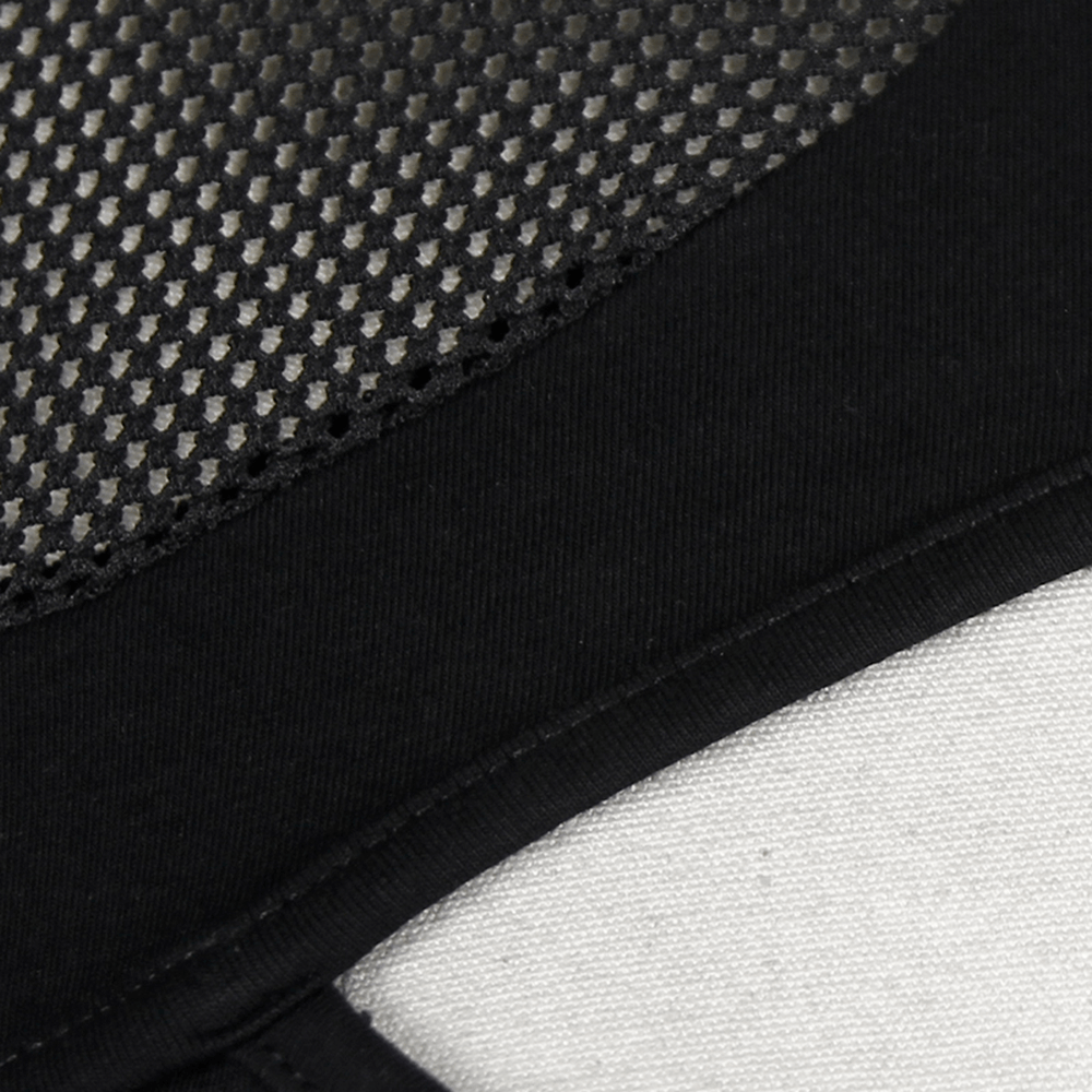 Close-up of a dark black mesh fabric showing hollow-out design and O-neck collar, perfect for gothic fashion enthusiasts.