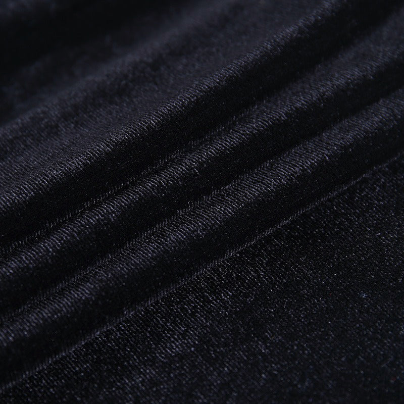 Close-up of luxurious black fabric, highlighting soft texture and sheen, perfect for gothic fashion.