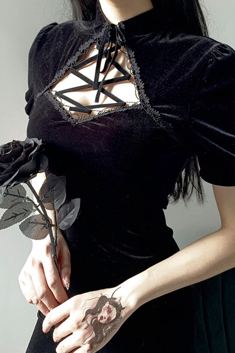 Gothic black dress with lace-up neckline and short puff sleeves, perfect for a dark vintage aesthetic look.