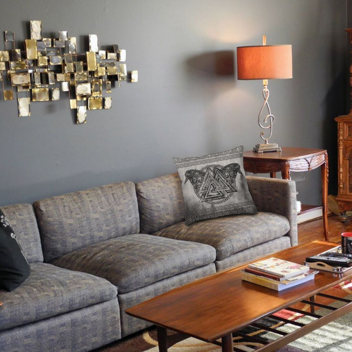 Viking-style decorative pillow cover with Valknut and ravens on a cozy living room couch.