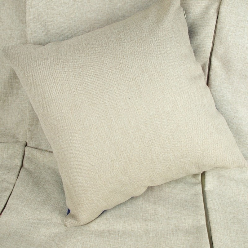 Neutral linen pillow on a cozy sofa, perfect for enhancing home decor with elegant simplicity.