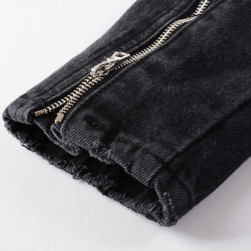 Close-up of the zipper detail on a stylish black denim punk jacket for men, showcasing trendy streetwear fashion.