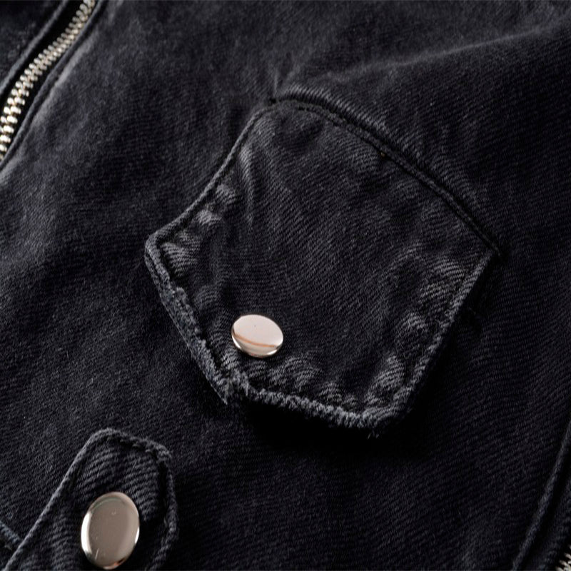 Close-up of denim jacket pocket featuring metal rivet detail and zipper, perfect for punk rock style enthusiasts.