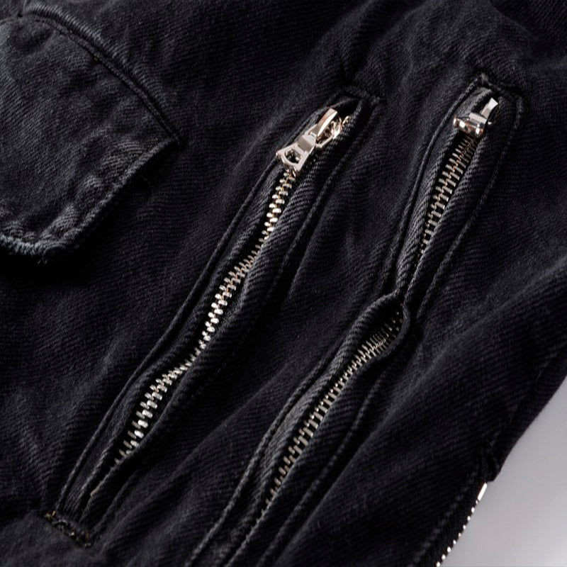 Close-up of stylish black zippers on a punk denim jacket, showcasing trendy design and functional pockets.