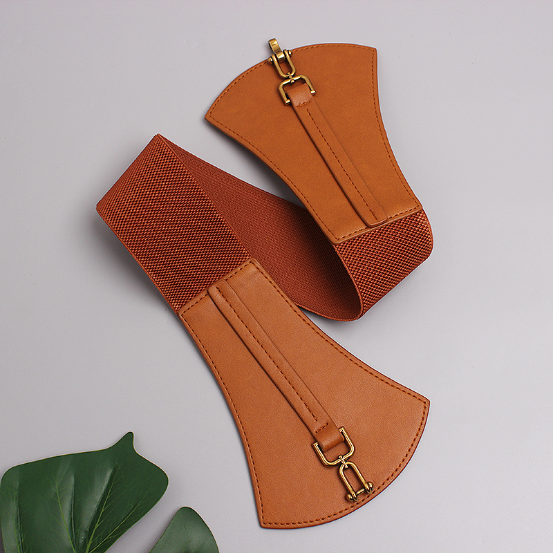 Designer PU leather wide belt with metal elements, perfect for vintage dresses and trendy outfits.