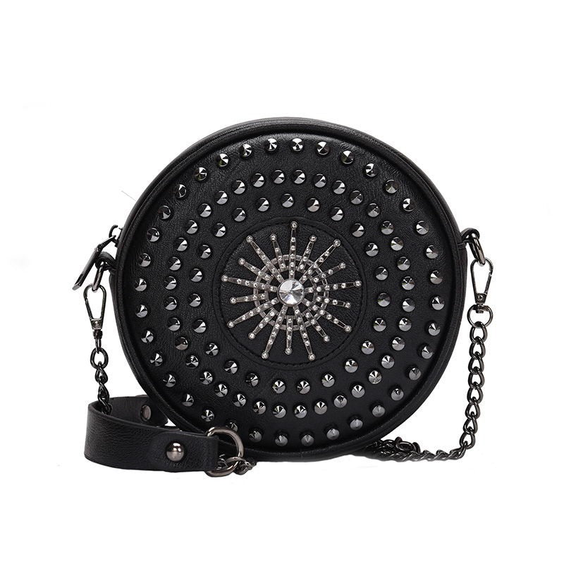 Stylish black circular bag for women with diamond and rivet decor, adjustable shoulder strap, and gothic design.