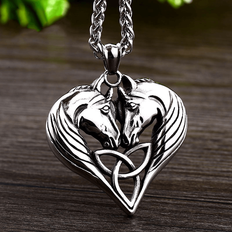 Stylish stainless steel unisex necklace featuring a heart-shaped pendant with double horse heads.