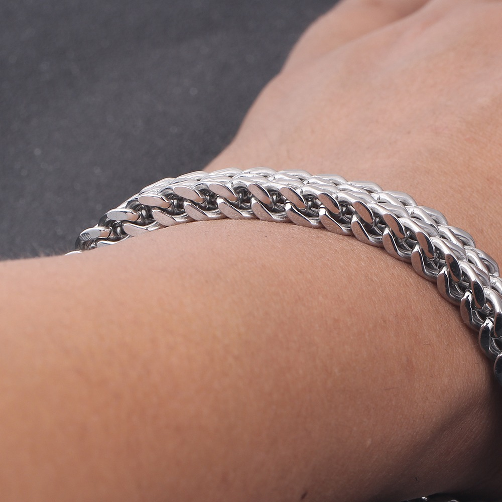 Double side chain bracelet on wrist, stylish stainless steel accessory for men and women, perfect for rock and alternative fashion.