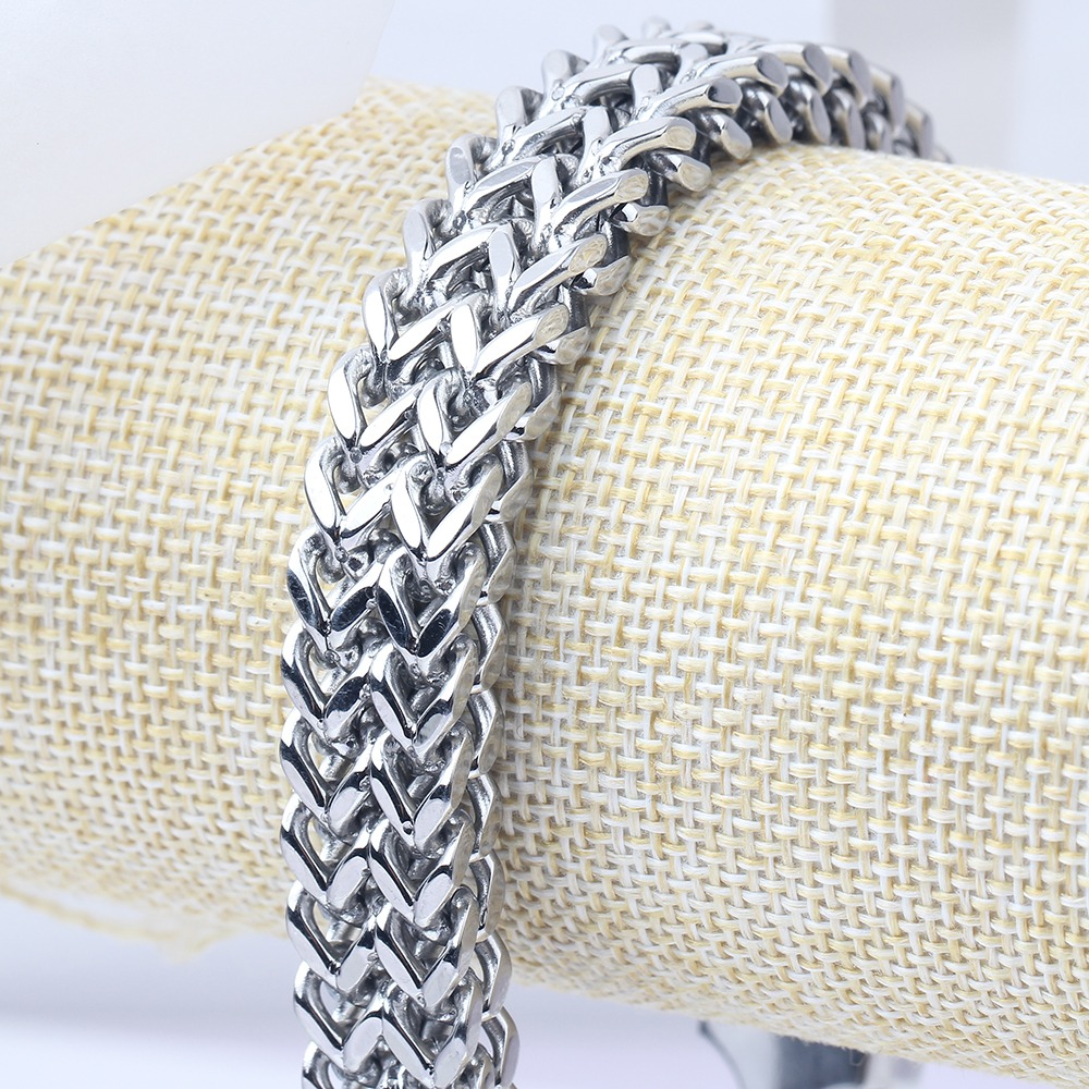 Close-up of a stylish double side chain bracelet in stainless steel, perfect for men's and women's alternative fashion.