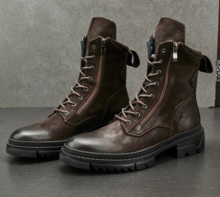 Stylish retro men's leather lace-up motorcycle boots in dark brown with flexible soles.
