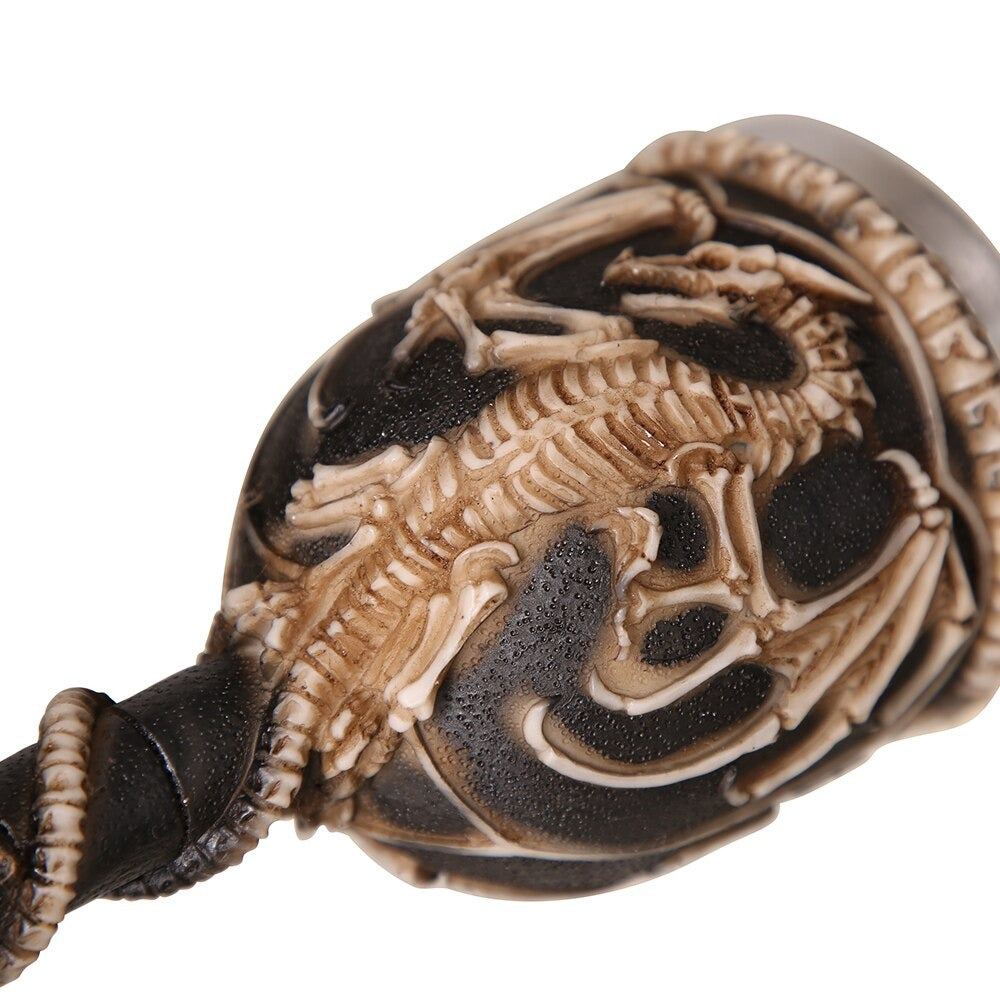 Close-up of a Gothic vintage wine glass with a dragon bone skeleton design, showcasing its unique and eerie details.