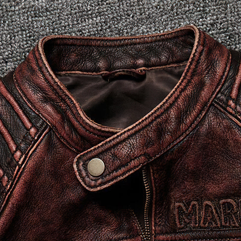 Close-up view of the collar of a durable brown biker jacket showcasing genuine leather and vintage style.