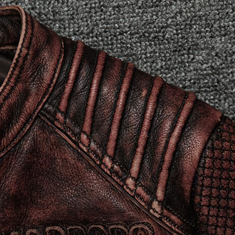 Close-up of durable brown biker jacket showing unique texture and stylish shoulder stitching details.