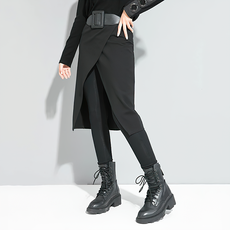 Stylish woman wearing black elastic high waist trousers with a decorative belt and lace-up boots, showcasing modern fashion.