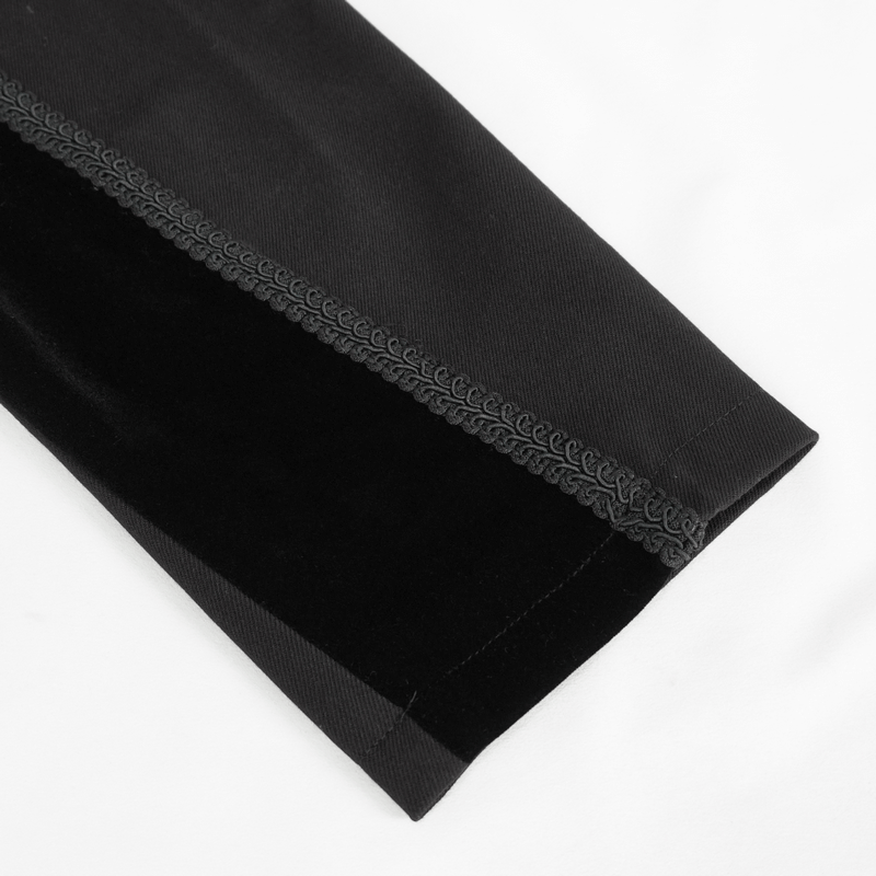 Close-up of the elegant black fabric texture and charming trim of a vintage men's gothic tail coat sleeve.