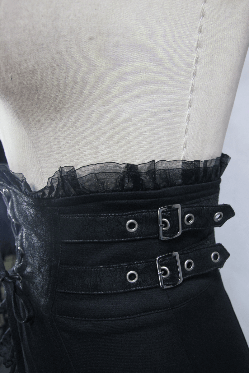Close-up of elegant black fishtail skirt with lace and buckle details for a gothic style.