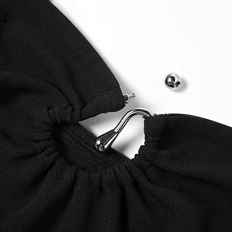 Close-up of the elegant black halter dress showing the hook and eye closure detail.