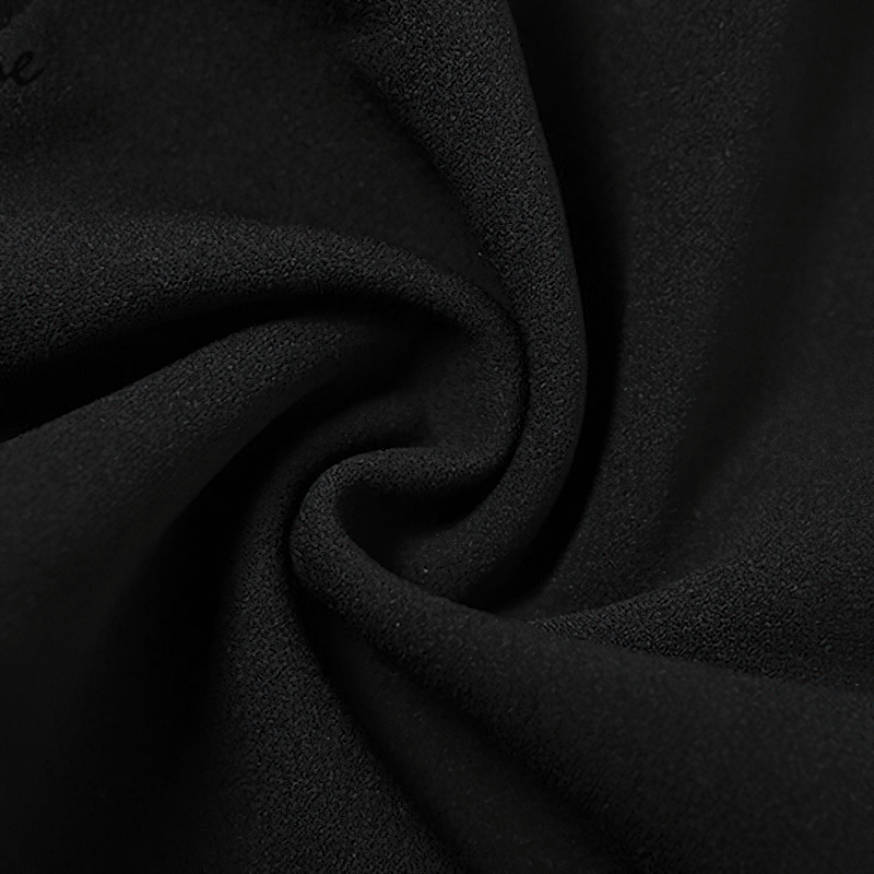 Close-up of luxurious black fabric, perfect for an elegant halter dress with a seductive punk style.