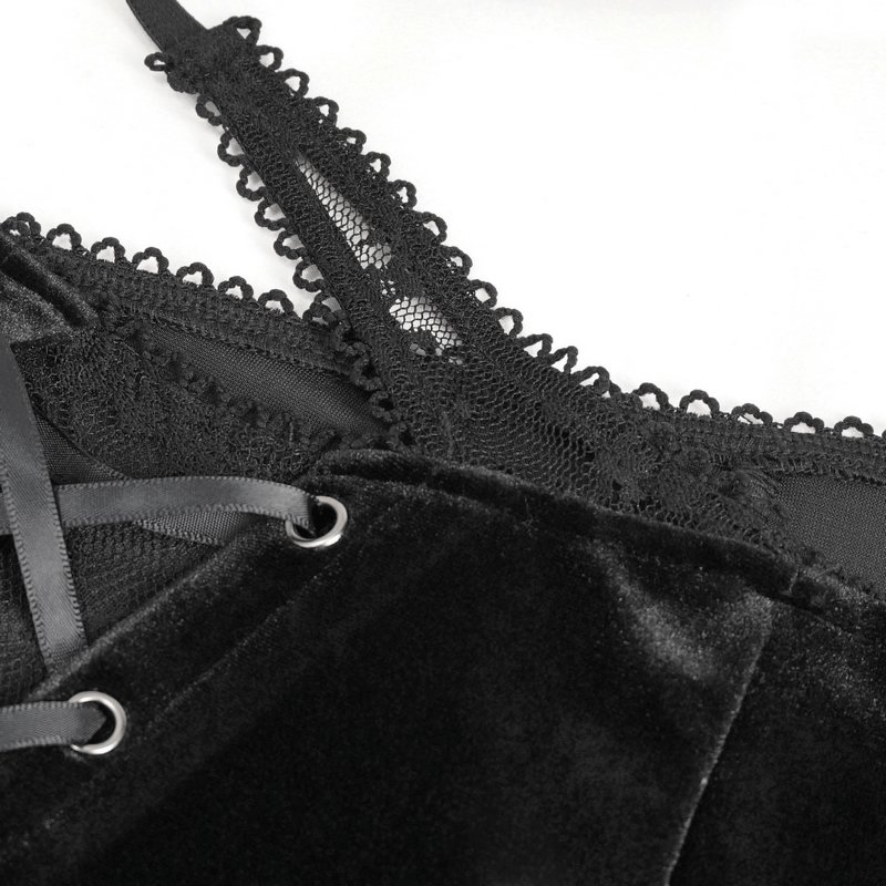 Close-up of elegant black velvet fabric with intricate lace detailing for gothic style women's fashion.