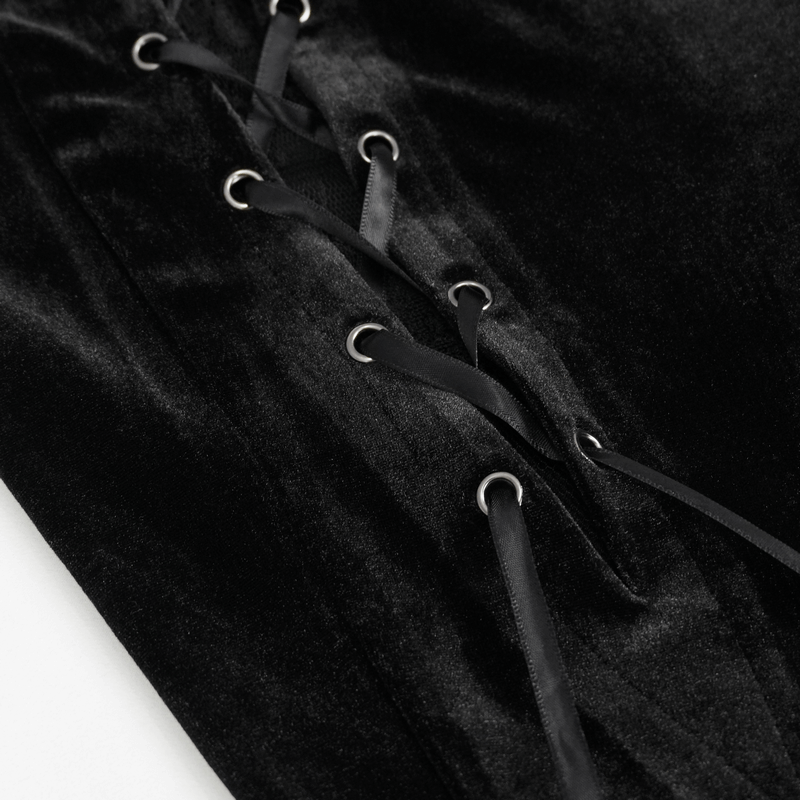 Close-up of gothic black velvet pants featuring lace-up detail and luxurious texture.