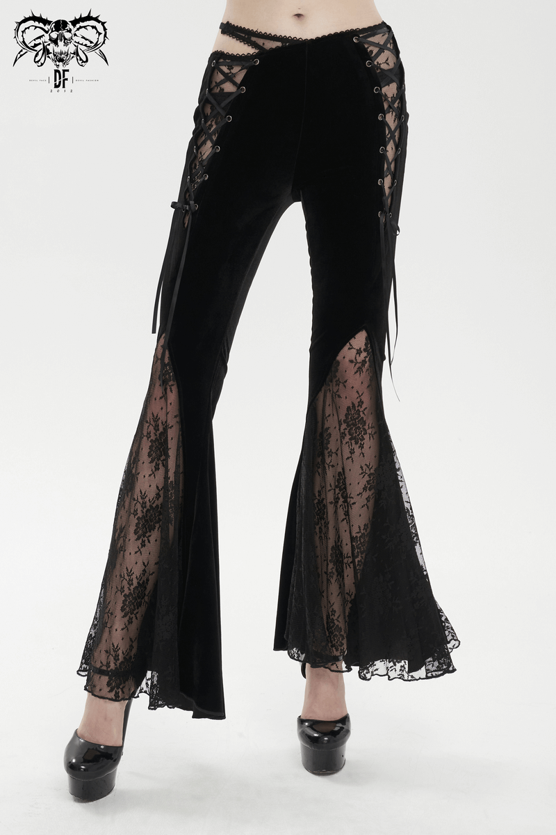 Elegant gothic black velvet flared pants with lace-up details and sheer lace panels, perfect for a stylish look.