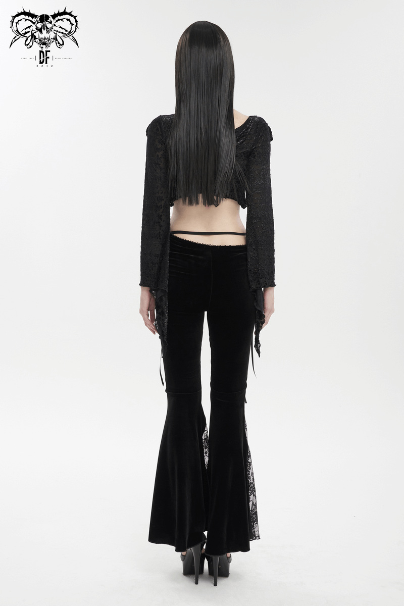 Stylish model showcasing elegant black velvet flared pants with gothic lace details, perfect for a gothic wardrobe.