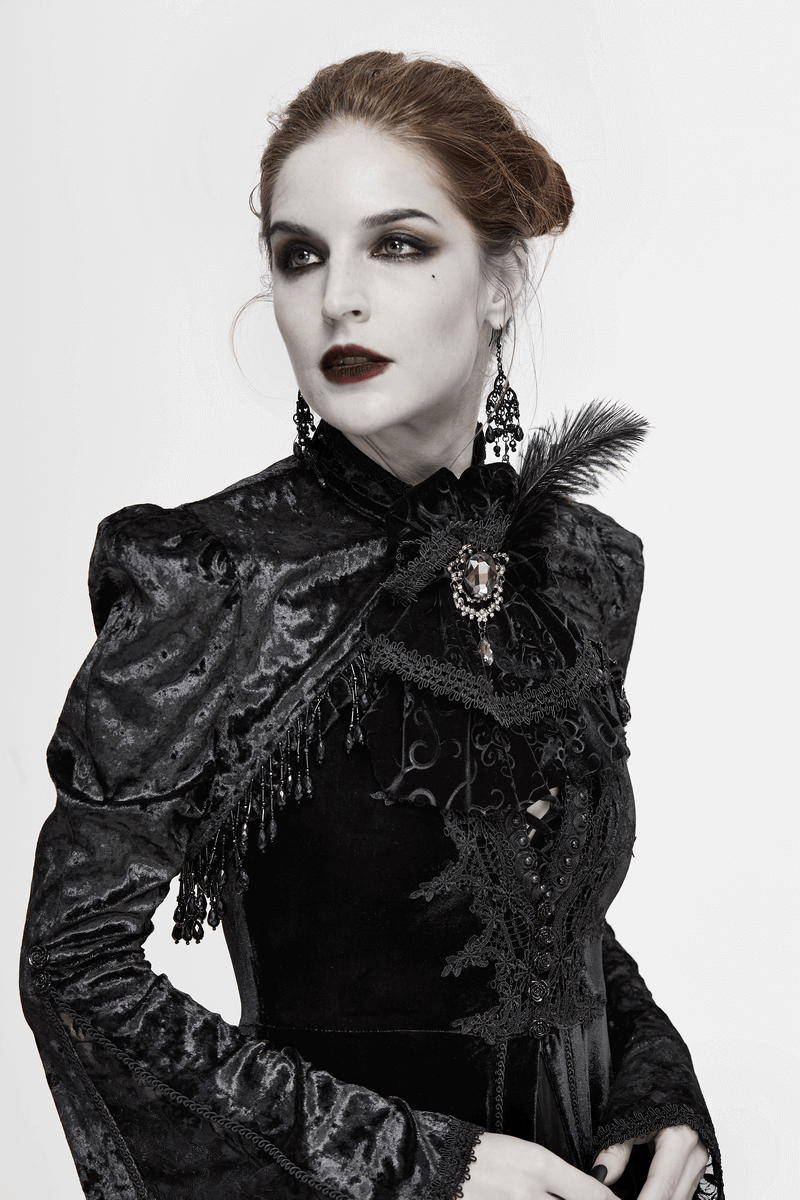 Elegant woman in gothic attire, showcasing a vintage black lace necktie with silver brooch and feather decoration.