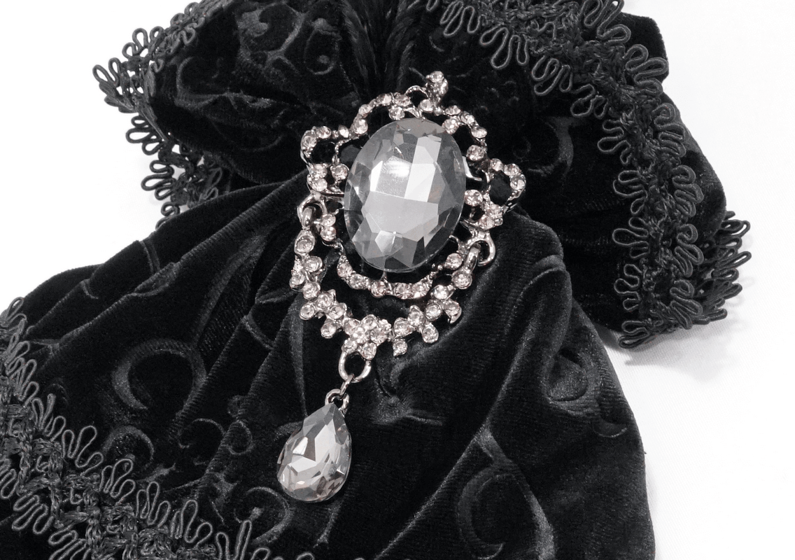 Gothic black velvet accessory with jeweled brooch and intricate lace detailing.